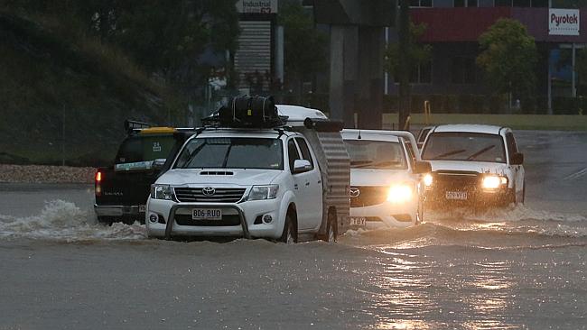 Three killed, including a child, after car swept away by floods