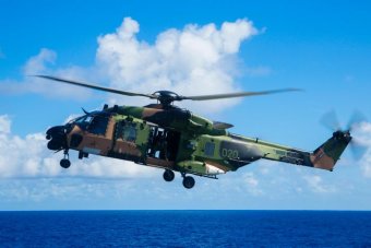 Navy, army helicopters proving difficult to operate in strong winds during sea trials on HMAS Canberra