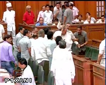 BJP MLA O.P. Sharma marshalled out of Delhi Assembly