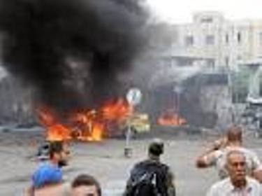 At least 100 killed in multiple blasts in Syria