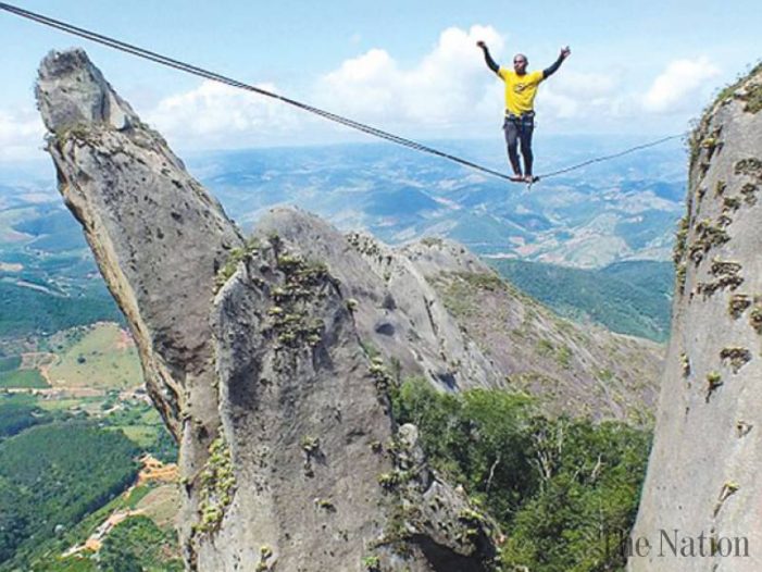 Daredevil crossing 1,640ft jagged mountain on a highline