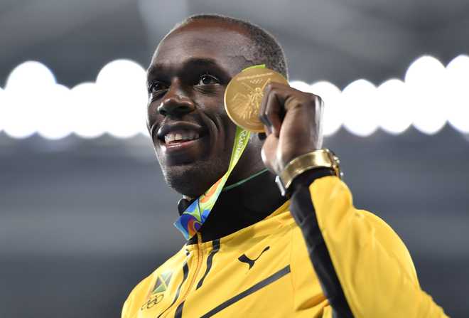 Bolt signs off with ‘triple-triple’ as Jamaica win relay race