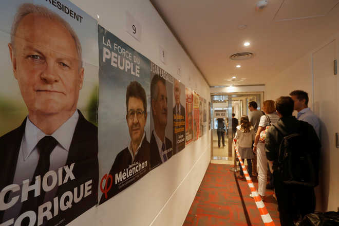 France votes in cliffhanger presidential election amid tight security