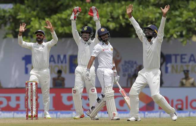 Karunaratne defies India with solid half-century in Galle Test