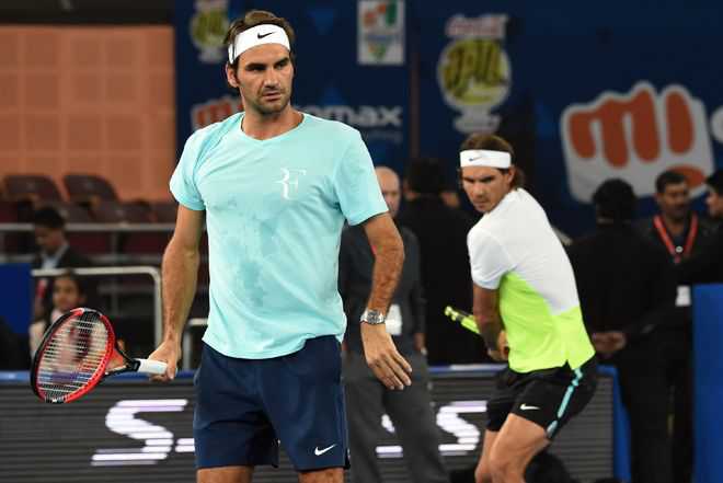 Nadal, Federer advance to third round of Shanghai Masters