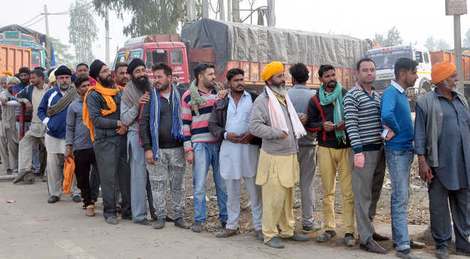 Few jobs, long queues, villagers fret