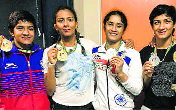 Phogat sisters return with four medals