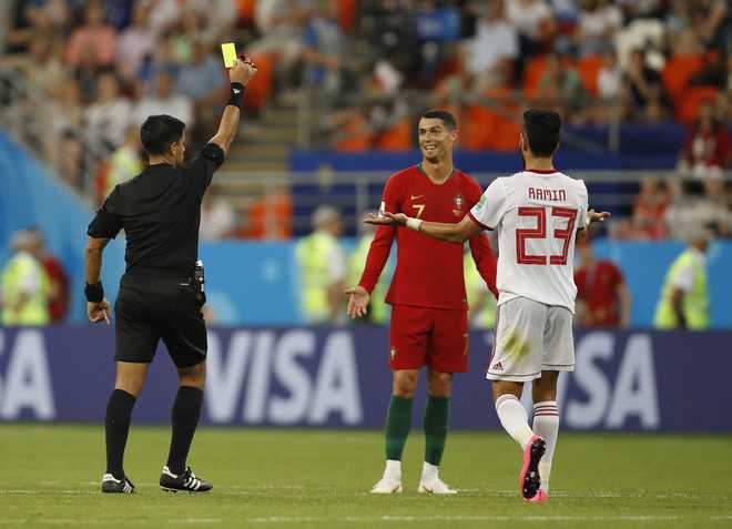 Portugal concede late penalty as Uruguay await in last 16