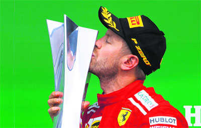 Vettel takes 50th victory and lead