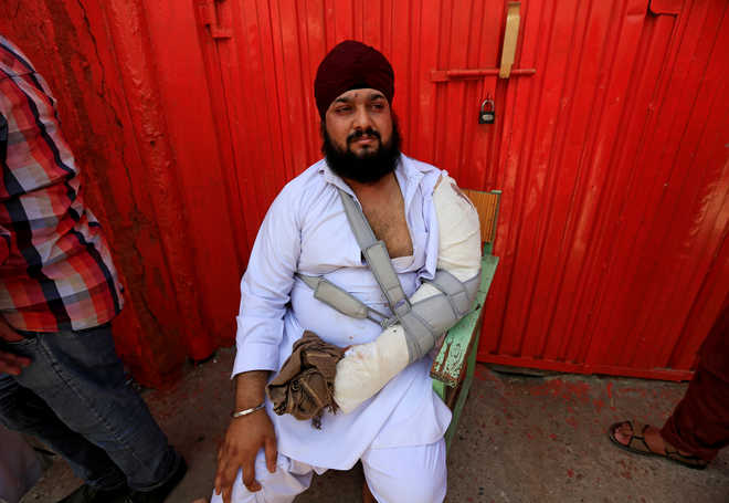 After deadly attack, Afghan Sikhs feel insecure about living there